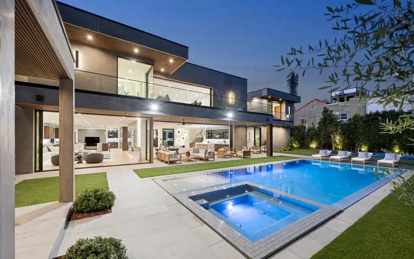 Modern La Jolla home with a pool at dusk