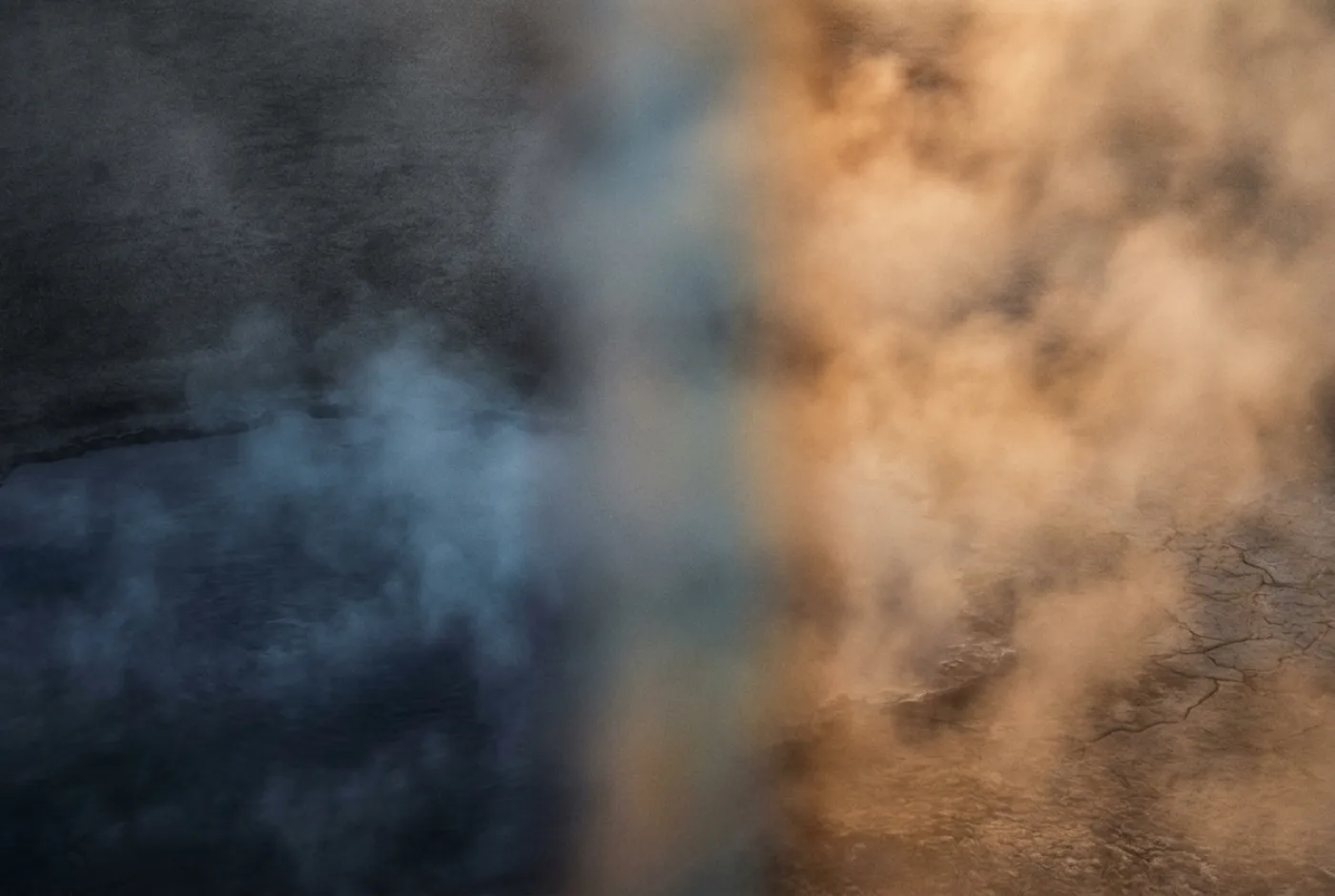 An abstract image of cold vapour meeting warm haze along a soft vertical seam