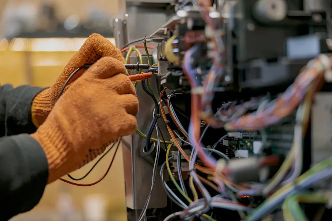 Electrician servicing an appliance circuit.