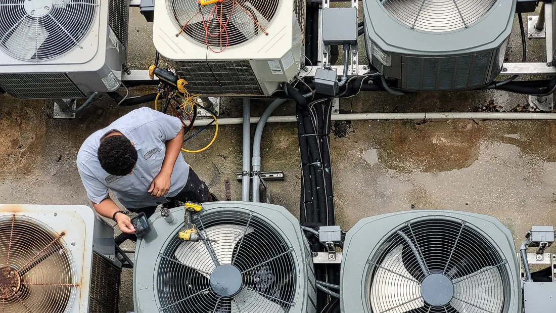HVAC technician servicing a system.
