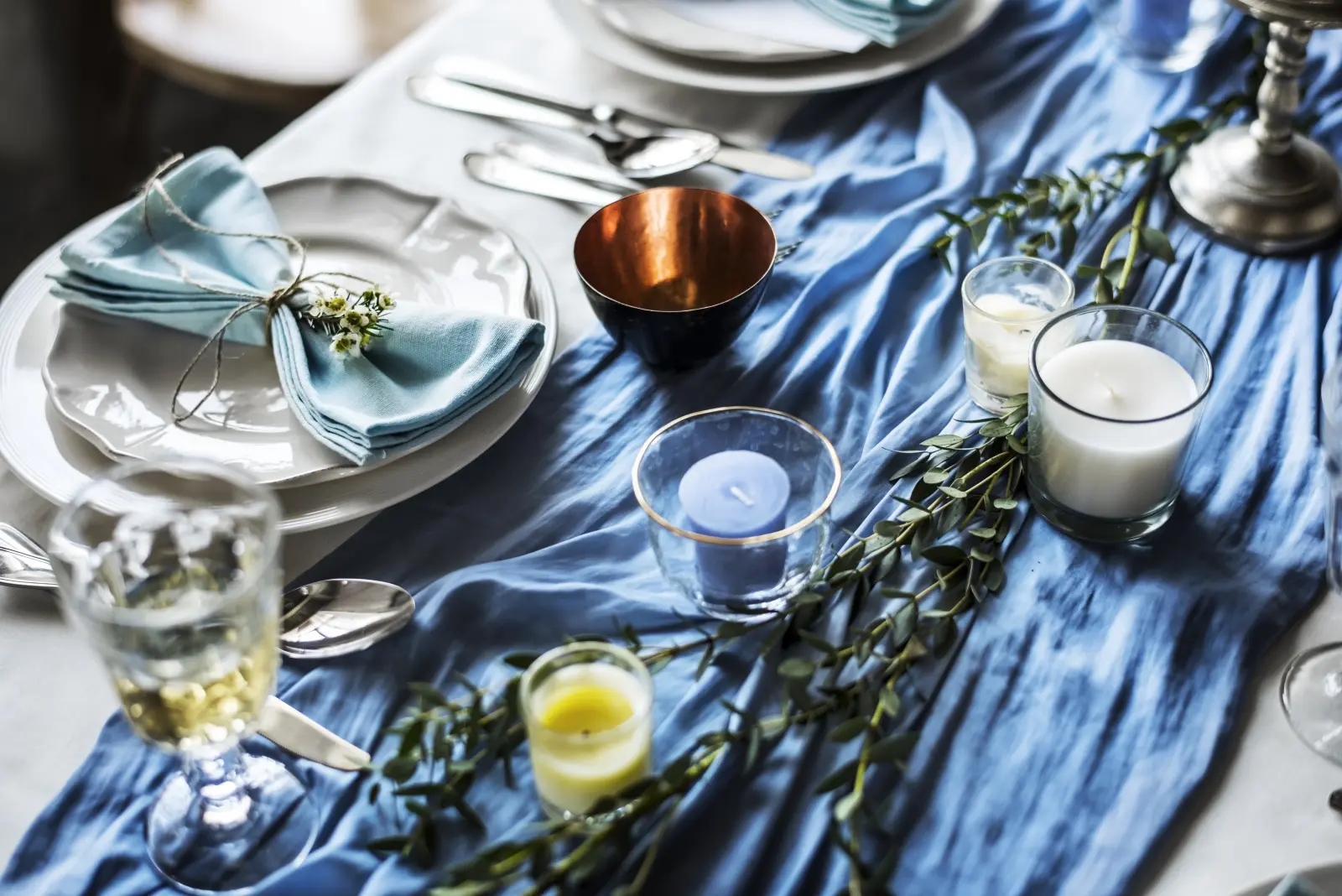 Reception tablescape detail with candles and florals.